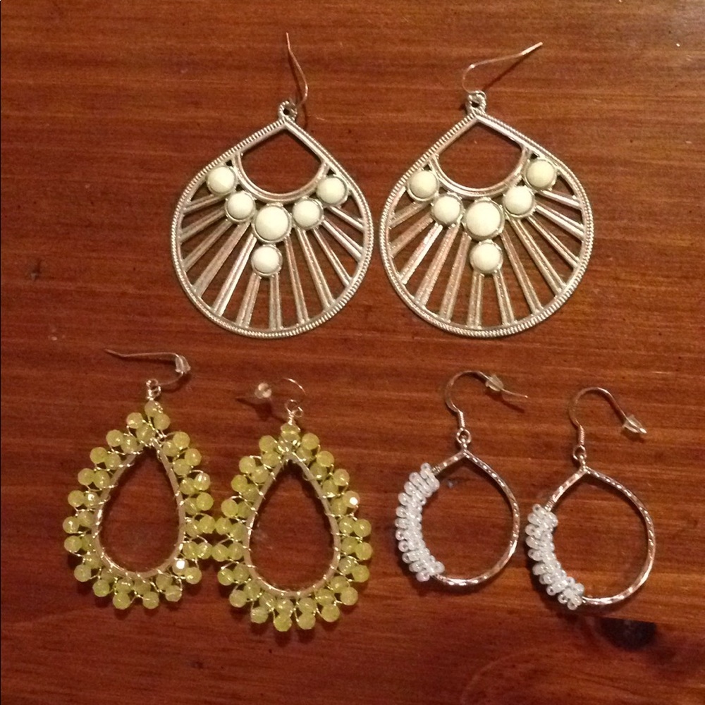 Three pair of costume earrings.
